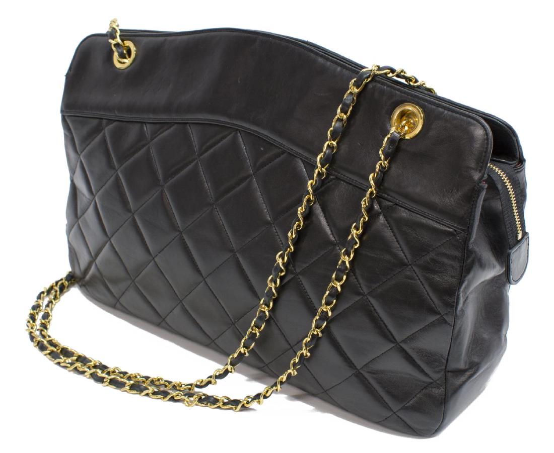 VINTAGE CHANEL BLACK QUILTED LEATHER SHOULDER BAG: Vintage Chanel shoulder bag, in black quilted leather, with gold-tone hardware, dual classic chain leather shoulder straps, burgundy leather lining, three pockets at interior walls, zip closure at top