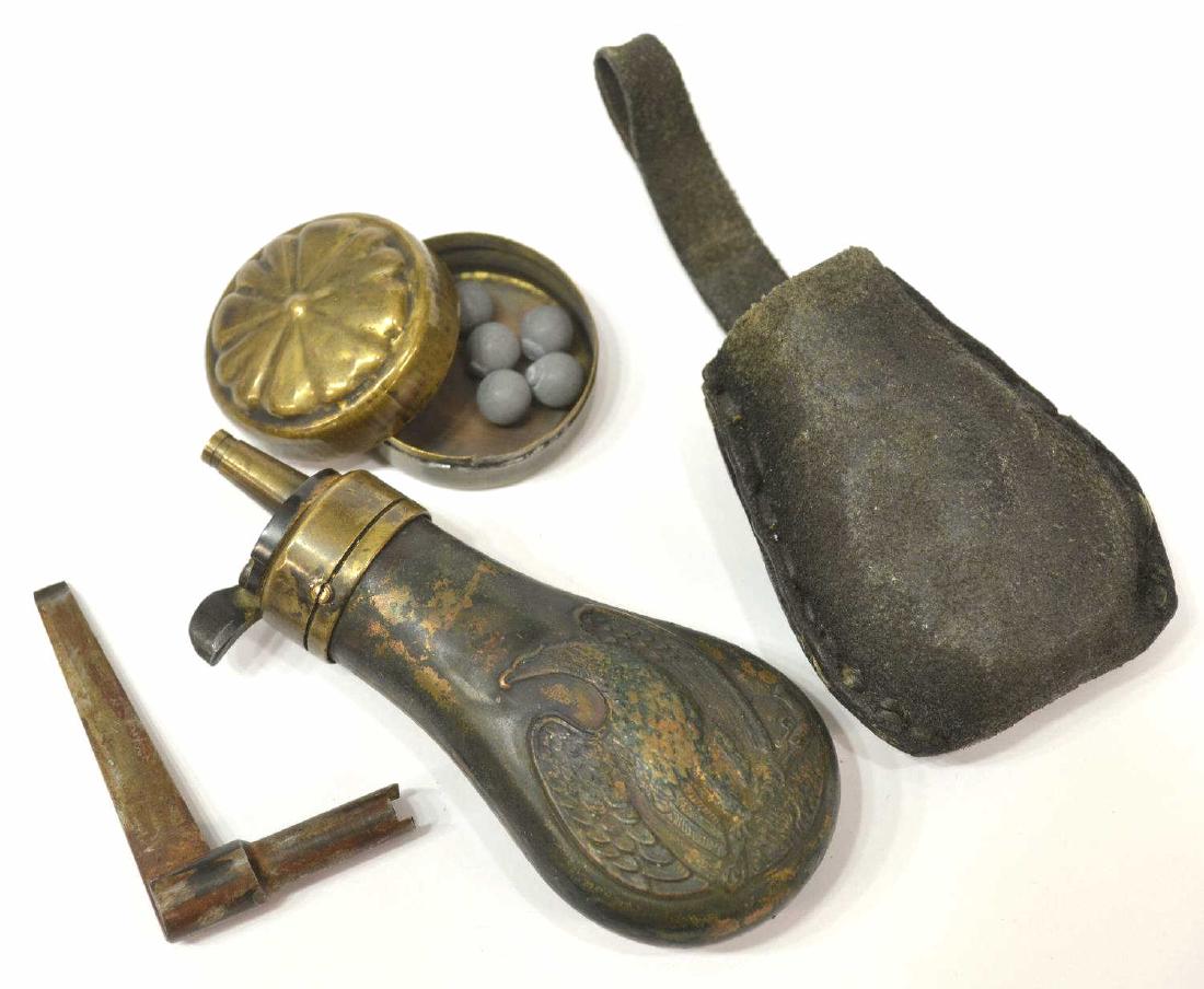 (3) COLT 1849 DRAGOON POWDER FLASK, WRENCH: (lot of 3) Early Colt Baby Dragoon copper powder flask, c. 1849, both sides with a raised eagle clutching a revolver, housed in a leather case with belt loop, 4.25"h; (1) Colt percussion nipple wrench