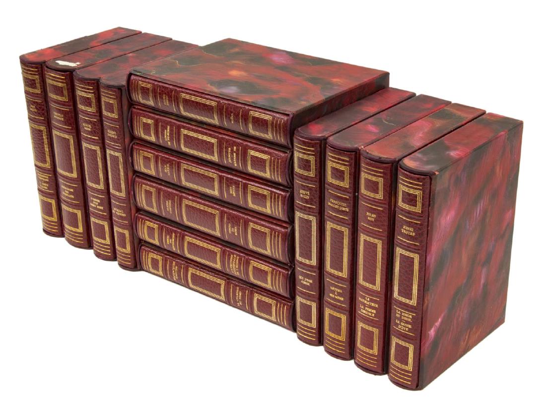 (14) FRENCH GILT RED LEATHER-BOUND LIBRARY BOOKS: (14 volumes) French library shelf books, "La Collection du Prix Litteraire Prince Pierre de Monaco," published by Editions Andre Sauret, gilt embossed red leather binding, with original lithograph ill