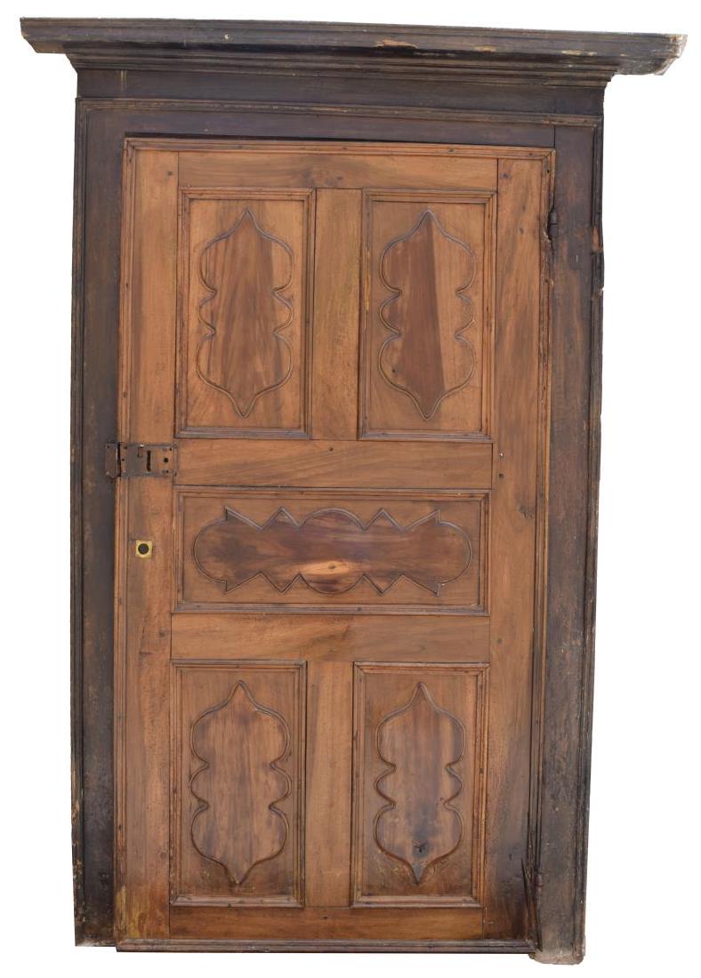 ITALIAN ARCHITECTURAL MONASTERY WALNUT DOOR: Italian architectural monastery walnut door, 18th c., having frame with cornice top, fitted with paneled door, wear, splits to boards, losses to frame, approx 87.5"h, 63"w, 7"d Start Price: $600.00