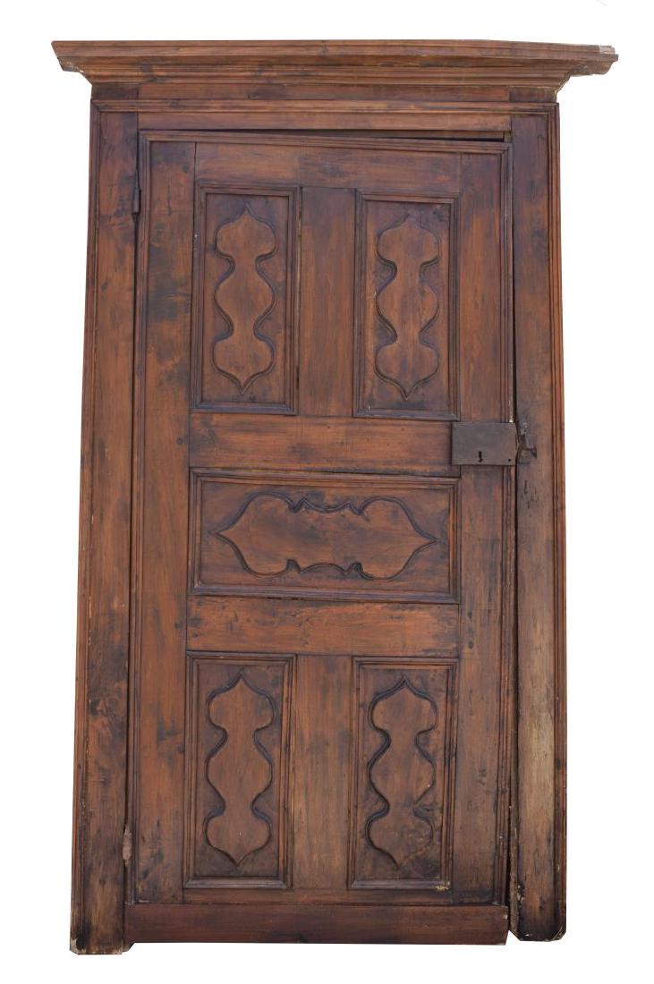 ITALIAN ARCHITECTURAL MONASTERY WALNUT DOOR: Italian architectural monastery walnut door, 18th c., having frame with cornice top, fitted with paneled door, wear, losses to frame, approx 84.75"h, 55"w, 5"d Start Price: $600.00