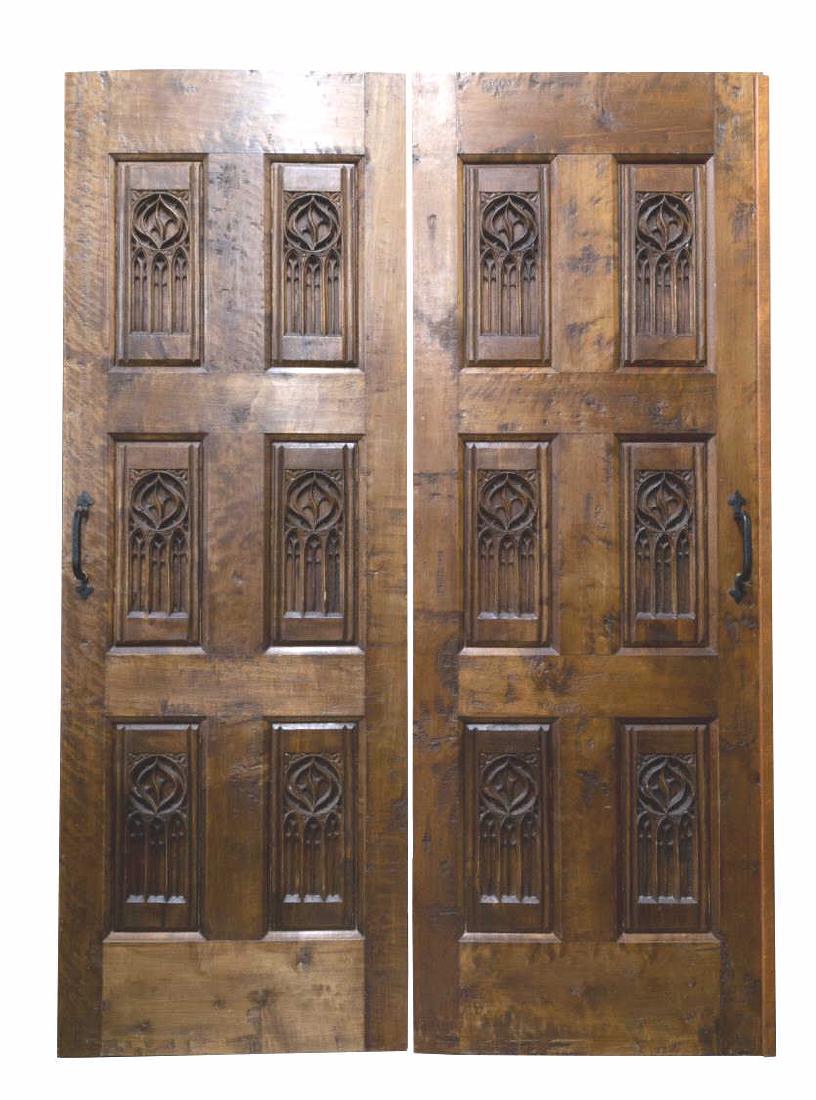 (PR) ARCHITECTURAL GOTHIC STYLE CARVED DOORS: (pair) Architectural Gothic style carved door set, both detailed to one side with tracery, later iron hardware, approx 79"h, (1) 28.25"w, (1) 29"w (inclusive of overlapping trim piece), 1.75"d **Prove