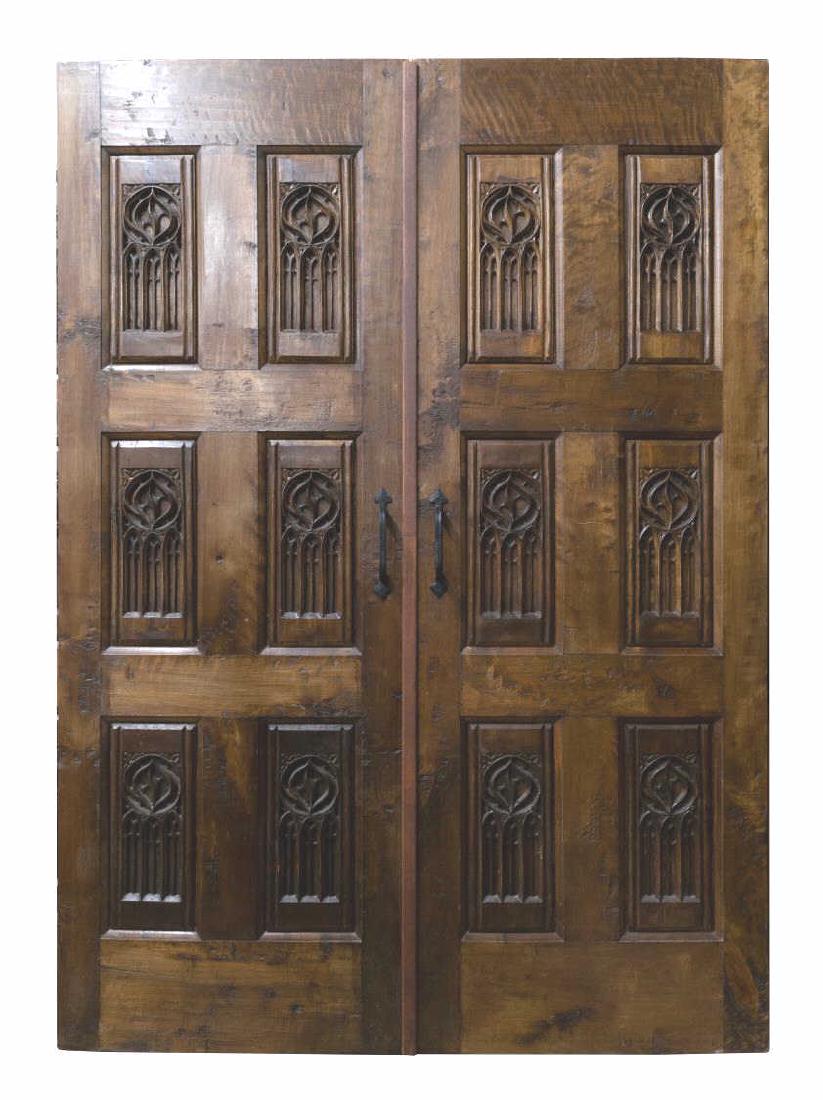 (PR) ARCHITECTURAL GOTHIC STYLE CARVED DOORS: (pair) Architectural Gothic style carved door set, both detailed to one side with tracery, later iron hardware, approx 79"h, (1) 28.25"w, (1) 29"w (inclusive of overlapping trim piece), 1.75"d **Prove