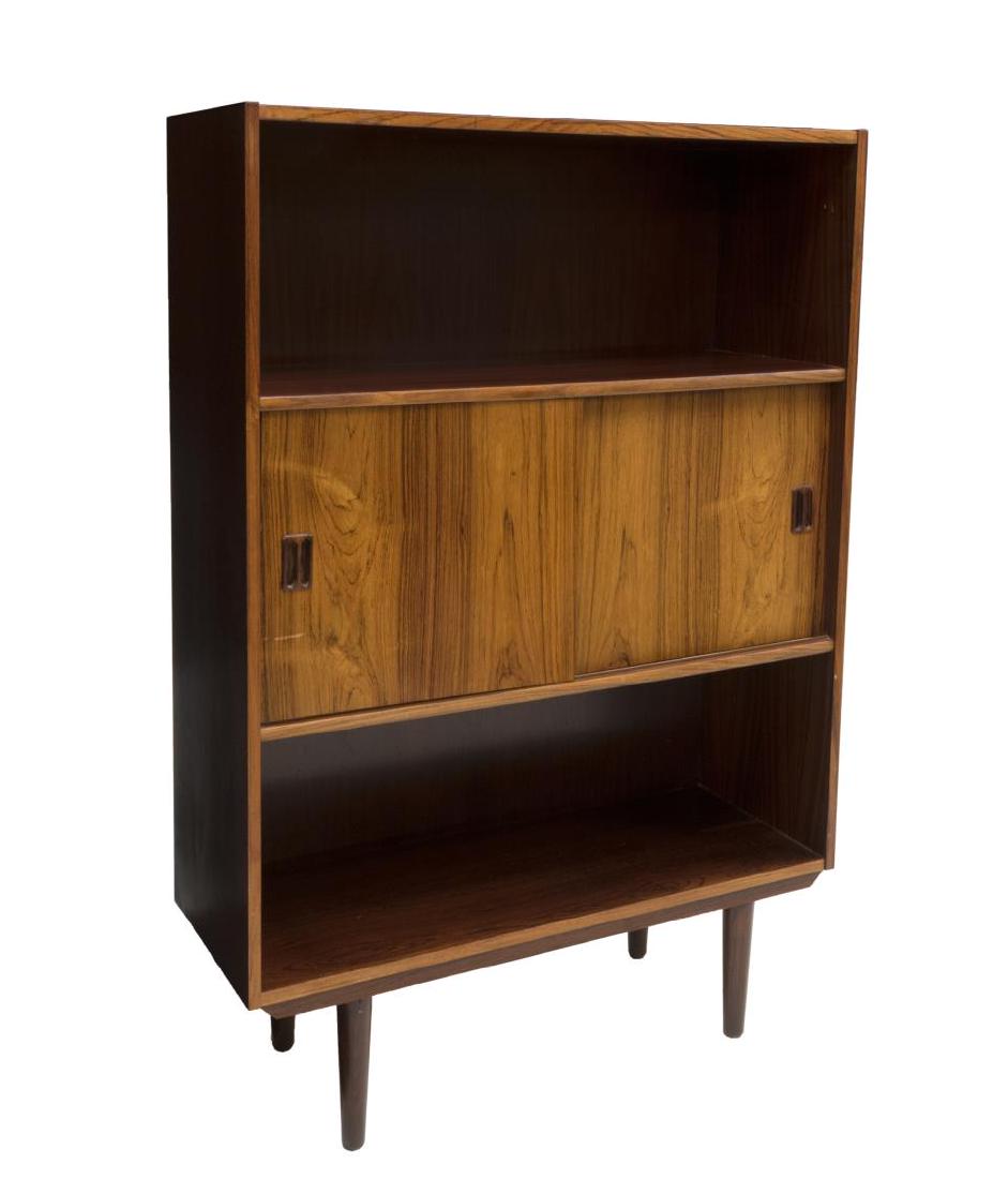DANISH MID-CENTURY MODERN ROSEWOOD BOOKCASE: Danish mid-century modern rosewood bookcase, c. 1960s, open upper and lower sections, center sliding doors, on cylindrical legs, approx 49.5"h, 34.25"w, 11.75"d Start Price: $150.00