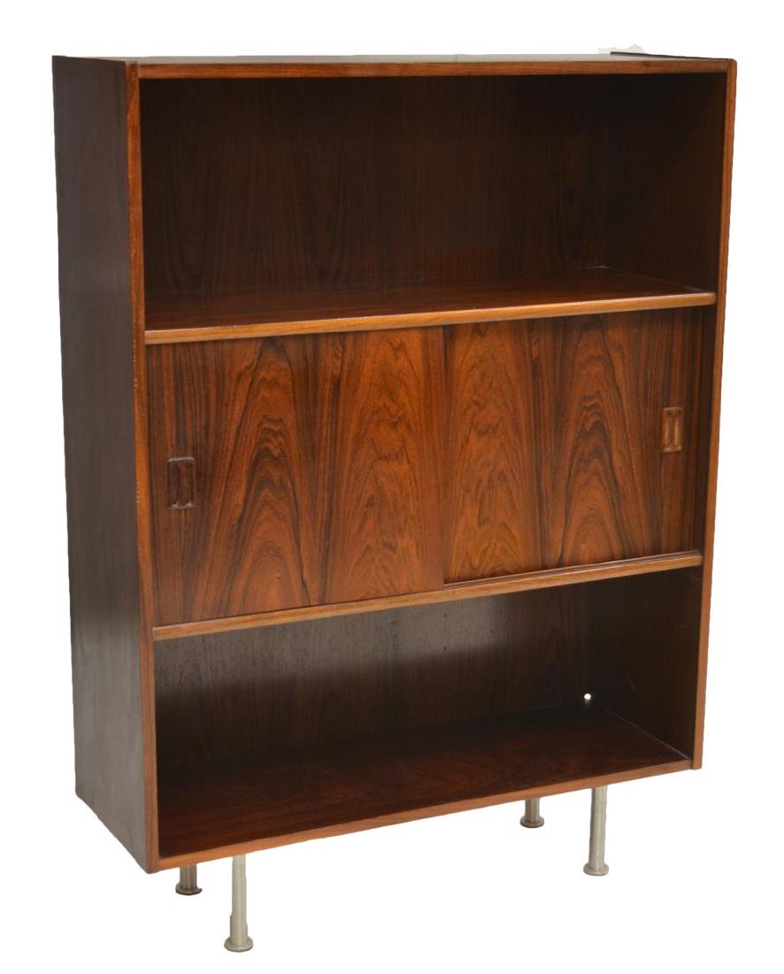 DANISH MID-CENTURY MODERN ROSEWOOD BOOKCASE: Danish mid-century modern rosewood bookcase, c. 1960s, open shelves at top and bottom with sliding doors at center, rising on chrome steel supports,47"h, 34.25"w, 12"d Start Price: $200.00