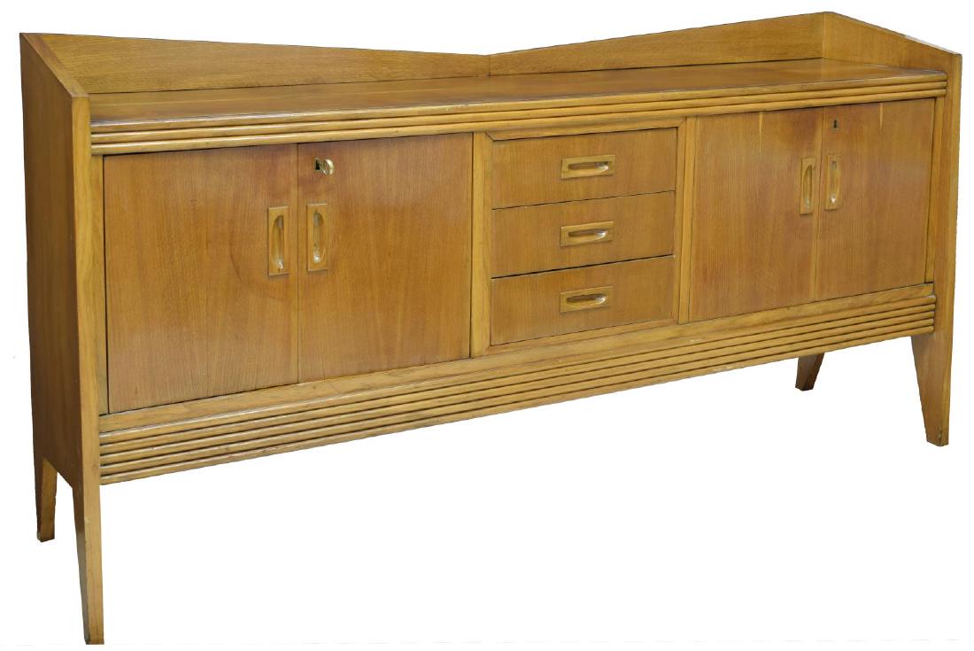 ITALIAN MID-CENTURY MODERN OAK SIDEBOARD: Italian mid-century modern oak sideboard, c. 1960's, angled gallery top over the rectangular case, fitted with central doors and side cabinet doors, shelved interior, on angled legs, approx 42.25"h, 8