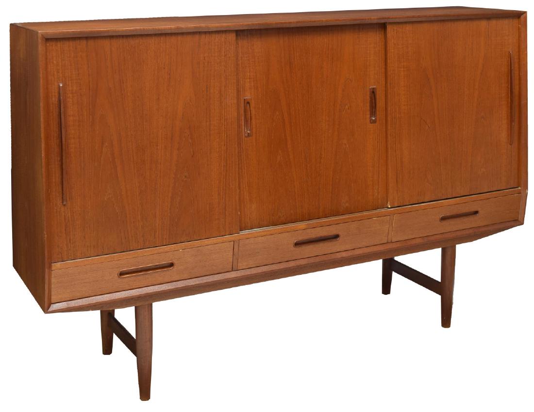 DANISH MID-CENTURY MODERN TEAKWOOD SIDEBOARD: Danish mid-century modern teak sideboard, c. 1950s, sliding doors open to shelving and tray drawers, above three drawers, on stretcher joined cylindricall legs, approx 44.25"h, 66.75"l, 17.5 Start Pri