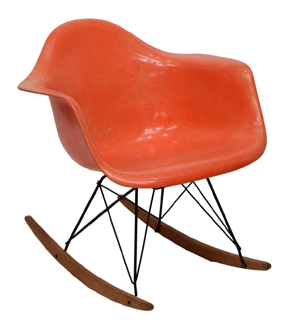 CHARLES EAMES HERMAN MILLER ROPE EDGE ROCKER: Mid-century modern rocking chair, design by Charles Eames for Herman Miller, c. 1950's, the rope edge RAR Zenith orange fiberglass molded seat rising on tubular metal base with wooden rockers, makers