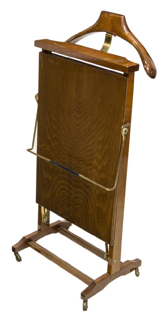 ITALIAN MID-CENTURY MODERN FRATELLI REGUITTI VALET: Italian mid-century modern valet, c. 1960s, manufactured by Fratelli Reguitti, fitted with coat hander, accessories tray, and trouser press, all on trestle base with casters, marked on frame, approx 3