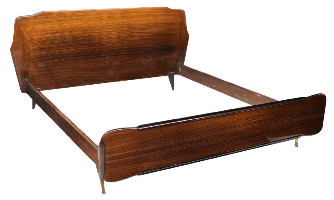 ITALIAN MID-CENTURY MODERN ROSEWOOD BED: Italian mid-century modern rosewood bed, c. 1960s, having shaped head and footboards, rising on tapered legs, label to back of headboard as pictured, exterior: approx 37.25"h, 76.75"w, 80.5"d, interio