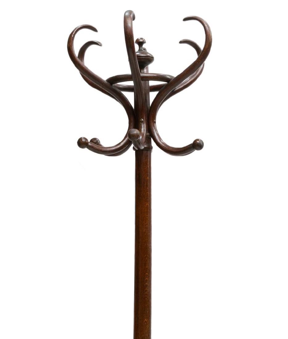 THONET STYLE BENTWOOD FREE STANDING HALL TREE: Thonet style bentwood hall tree, late 19th/ early 20th c., having six hooks surrounding center finial, base with ring for holding umbrellas or canes, rising on four out-swept feet, approx 75"h, 29"dia