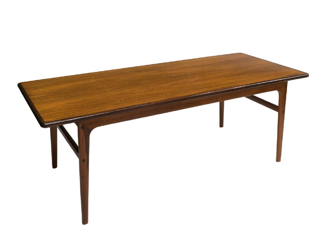 DANISH MID-CENTURY MODERN ROSEWOOD COFFEE TABLE: Danish mid-century modern rosewood coffee table, c. 1960s, the rectangular top with banding on shaped stretcher joined supports, approx 20.75"h, 59.25"w, 23.5"d Start Price: $150.00
