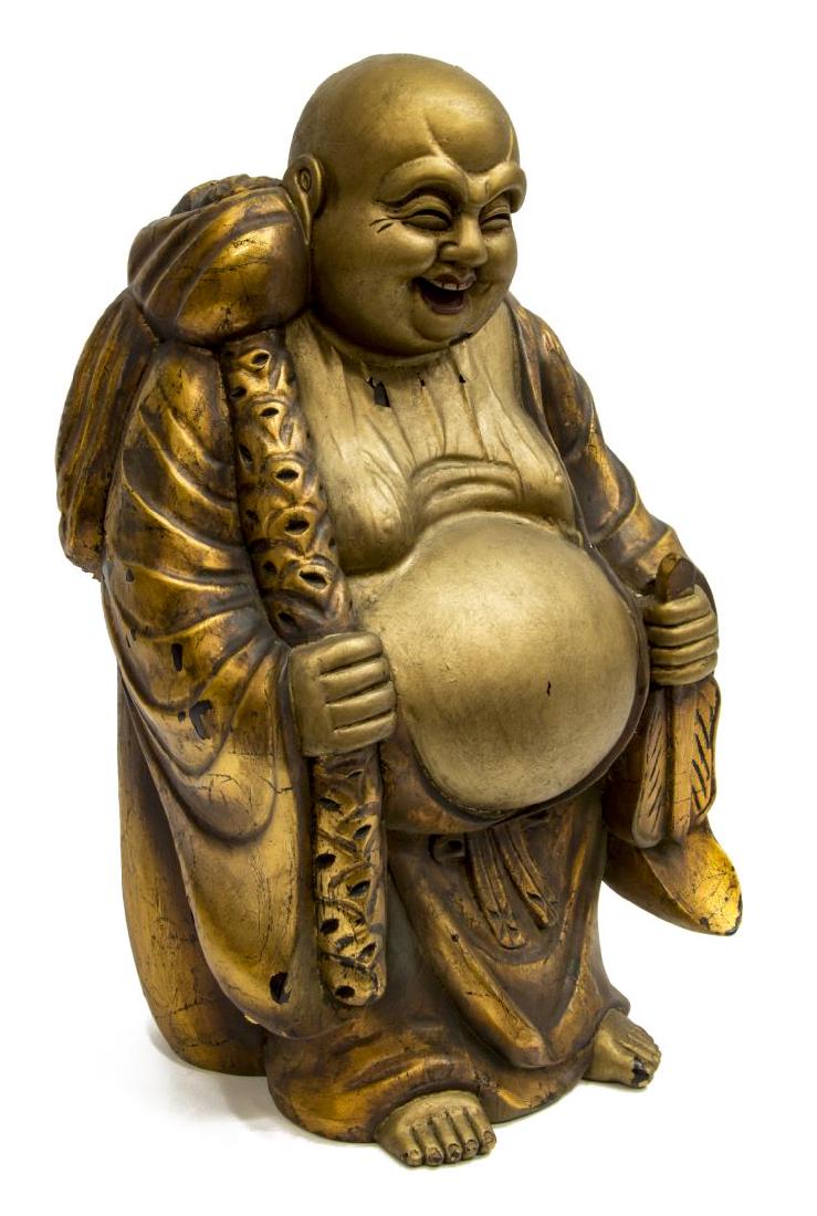 ANTIQUE CHINESE GILT CARVED WOOD HOTEI BUDDHA: Antique Chinese gilt painted carved wood Hotei (Laughing Buddha) statue, holding a fan and a staff with bindle, approx 23"h, 13.5"w, 12"d, 31.5lbs Start Price: $80.00