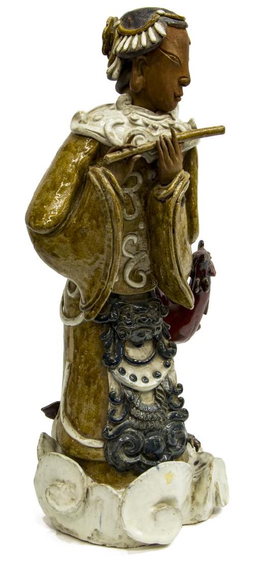 CHINESE CERAMIC WOMAN PLAYING FLUTE WITH PHOENIX: Chinese glazed terracotta woman playing flute with red phoenix standing on stylized clouds, wearing Foo dog decorated kimono and beaded headdress, imprinted character mark inside, approx 28"h, 13"w, 1