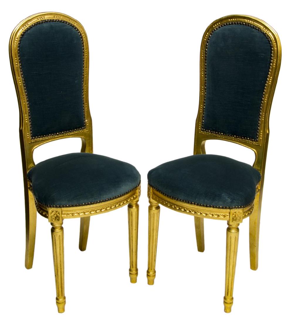 (2) VENETIAN LXVI STYLE GILTWOOD HALL CHAIRS: (pair) Venetian Louis XVI style giltwood hall chairs, 20thc, each having slim back and cushioned seat in blue velvet-like upholstery, on carved frame and fluted legs, approx 38.5"h, 16"w, 12.5"d Start