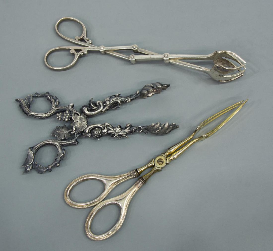 (3) LOT RUSSIAN 875 & OTHER STERLING SILVER TONGS: (lot of 3) Sterling and 875 silver tongs: (pair) Russian 875 silver grape vine tongs, leafy and floral accents, Johan Bernard Hertz, St. Petersburg, 1834-1855, hallmarked 84, IBH and symbol, 6"l; (pai