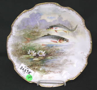 LIMOGES FISH PLATE ARTIST SIGNED. TWO FISH, WATER: LIMOGES FISH PLATE ARTIST SIGNED. TWO FISH, WATER LILLY SCENE, SIGNED RERIC, BACK MARKED: GREEN STAR LIMOGES FRANCE & IN RED "LOEB H'NOS, MEXICO, LIMOGES", 9.5"D, .25LB, GOOD CONDTION.