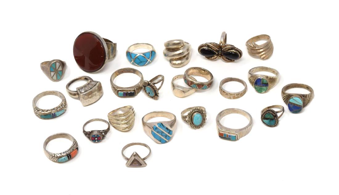 (23) GROUP SOUTHWEST SILVER & TURQUOISE RINGS: (lot of 23) Collection of men's and women's Southwest and similarly styled rings, including examples with turquoise, carnelian, and coral stones, many in marked sterling silver settings, highlights in