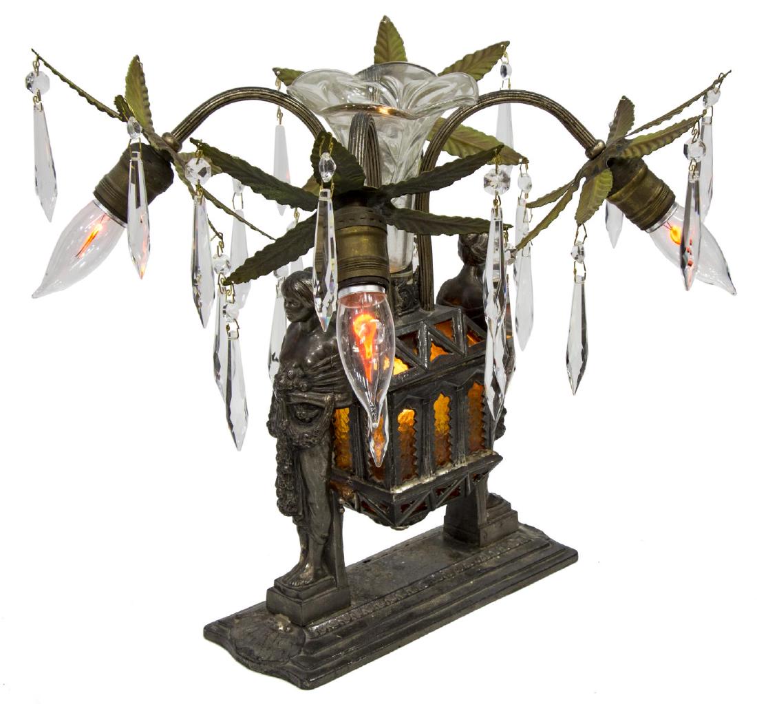 DECORATIVE FIGURAL FIVE-LIGHT METAL TABLE LAMP: Decorative five-light table lamp, 20th c., having glass vase, over central casket, with amber glass panes concealing a single light, issuing four arms, ending in light sockets and foliates hung with c