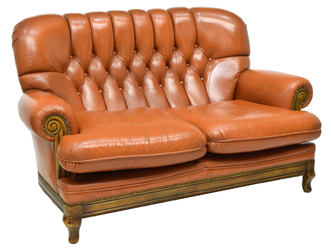 ENGLISH BUTTONED LEATHER LOVESEAT: English leather loveseat, having scrolling padded arms, button back, removable seat cushions, nail head trim, walnut frame, rising on cabriole legs, 34.5"h, 60"w, 31.5"d Start Price $200.00