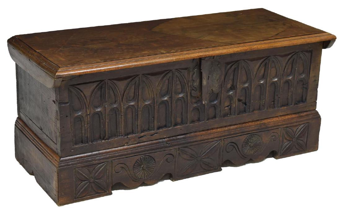 FRENCH 19TH C. GOTHIC STYLE TRUNK: French Gothic style oak trunk, 19th c., the hinged top opening to storage, the front with gothic carving ornate lock plate, 18.75"h, 44"w, 17"d Start Price: $100.00