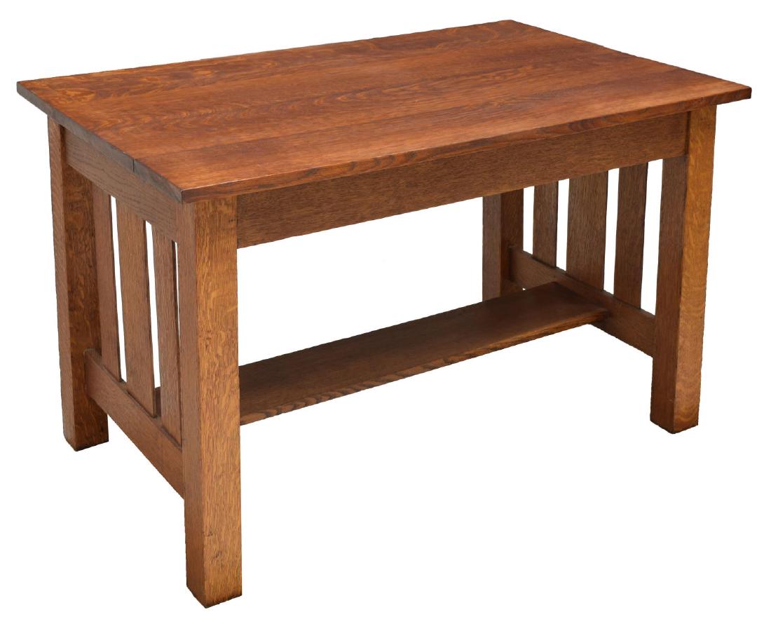AMERICAN MISSION OAK LIBRARY TABLE: American Mission Oak library table, early 20th c., having a rectangular top, open slat sides, raised on squared legs joined by a wide stretcher, 30"h, 48"w, 31"d Start Price: $150.00