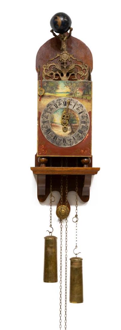 CONTINENTAL WEIGHT-DRIVEN WALL CLOCK: Continental wall clock, having gilt metal figure of Atlas over the bell, housed in shelf-style case, clock face with painted cottage scene, silver-tone chapter ring with black roman numerals, weight-d