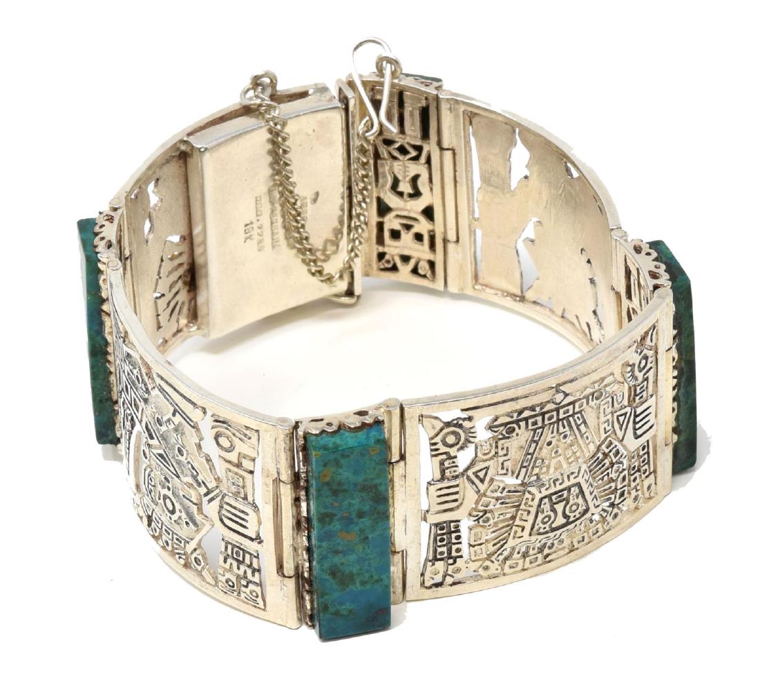 PERUVIAN STERLING SILVER INCA CUFF BRACELET: Peruvian sterling silver cuff bracelet, with Incan inspired designs, set with four malachite stones, clasp closure with safety chain, hallmarked Arie Orfebre SA Ind Peru, stamped 925 on clasp, approx 
