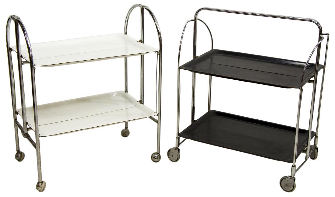 (2) INDUSTRIAL MODERN GERLINOL FOLDING TROLLEYS: (lot of 2) Mid-century industrial folding trolleys, c. 1950s, having chromed metal frames, one with white trays, one with black trays, on wheels, the example with black trays stamped Gerlinol, approx
