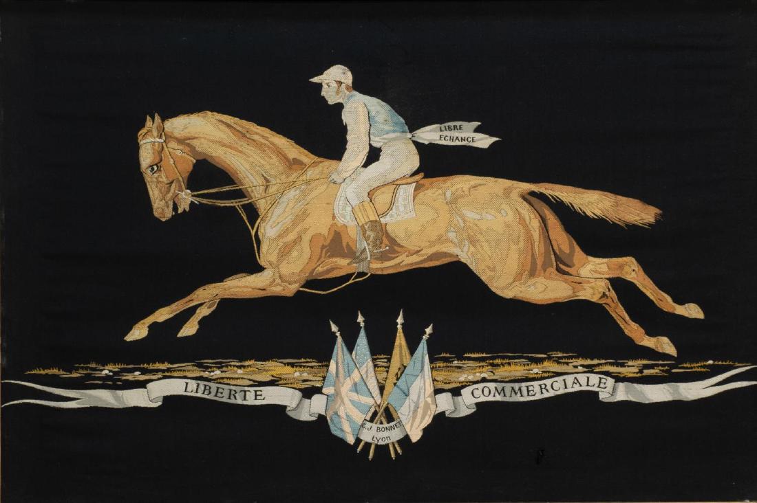 FRAMED SILK EQUESTRIAN PANEL FOR C.J. BONNET, LYON: Framed woven silk panel, late 19th c., by Tassinari and Chatel for C.J. Bonnet, Lyon, brocaded black silk taffeta ground with woven horse and jockey, over a sash bearing the words Liberte Commerciale,