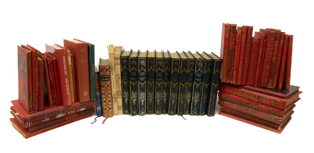 (50) COLLECTION OF HARDCOVER LIBRARY SHELF BOOKS: (lot of 50) Collection of French hardcover library shelf books, many with red leather and imitation leather binding with embossed boards and spines, highlights include: (12) volumes by Marcel Pagnol (