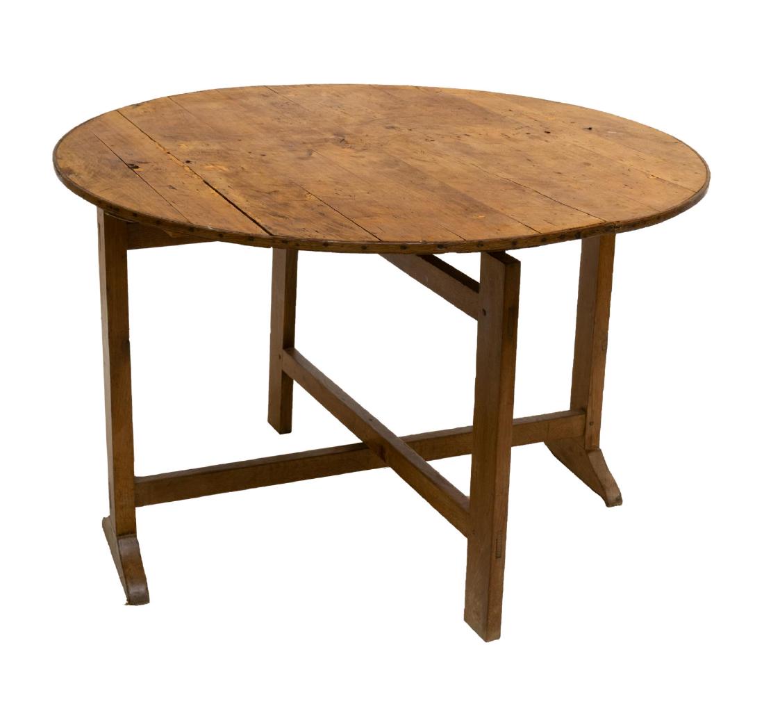 FRENCH OAK & POPLAR TILT TOP WINE TABLE: French mixed wood tilt top wine table, c. 1880's, the large circular top, opening on folding x-form base, approx 27.75"h, 42"diam, upright: 46.5"h Start Price: $200.00