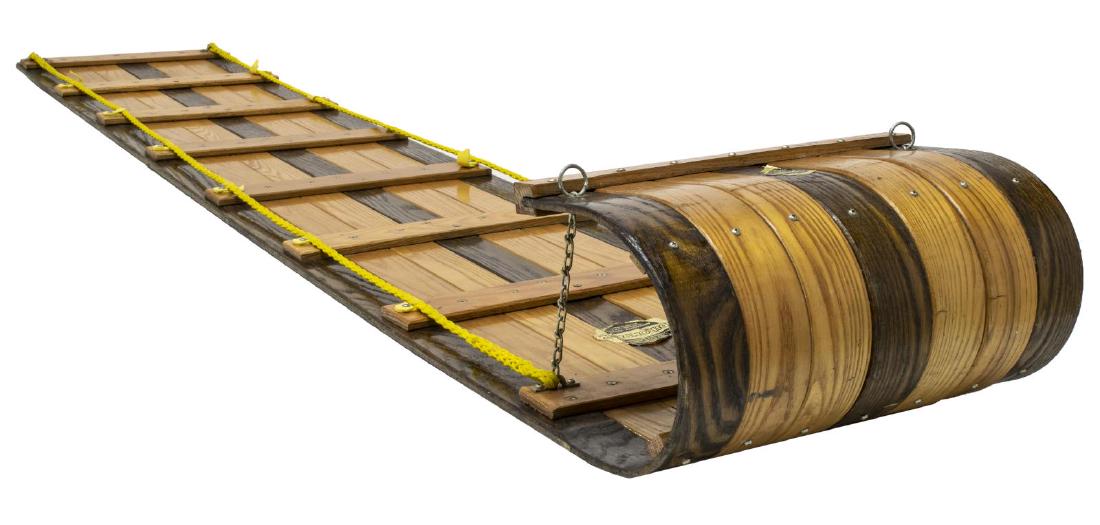 LARGE VINTAGE ADIRONDACK-PETERS TOBOGGAN SLED: Vintage Adirondack-Peters two-tone wood toboggan sled, retaining partial tag, plastic loops for rope all with loss, 9"h, 95"l, 18.25"w Start Price: $60.00