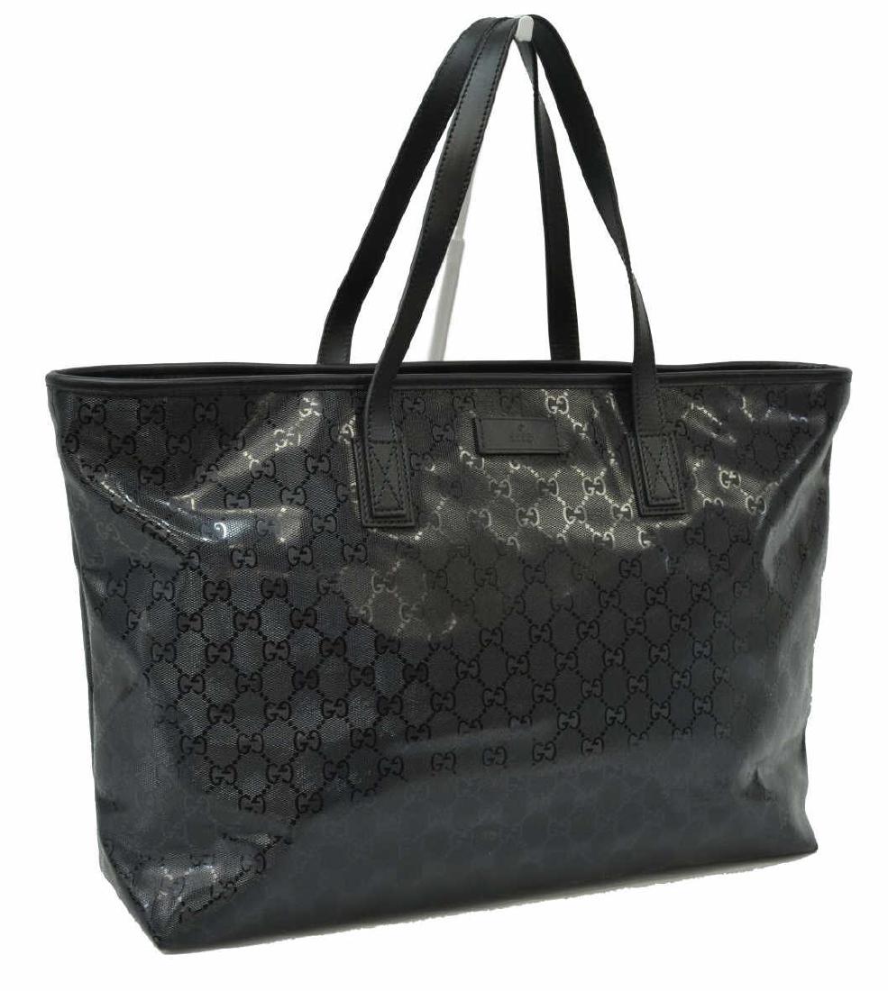 GUCCI BLACK GUCCISSIMA IMPRINT CANVAS TOTE BAG: Gucci large tote bag, in black Guccissima imprint coated canvas, with dual rolled handles, two interior slit pockets and single zip pocket, zip closure at top, creasing, some interior spotting, bag: m