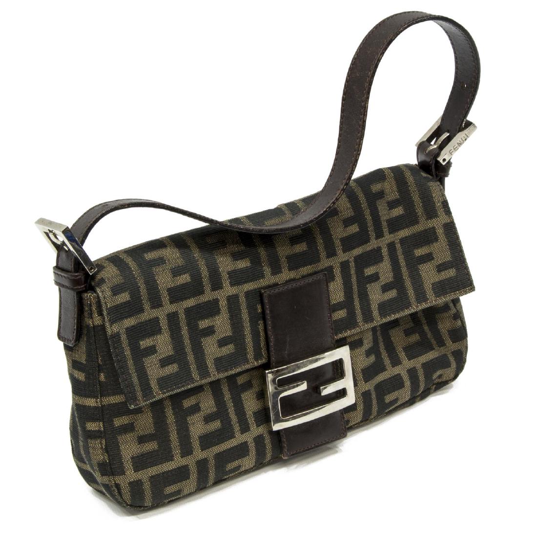 FENDI ZUCCA MONOGRAM CANVAS BAGUETTE FLAP BAG: Fendi baguette flap bag, in brown Zucca monogram canvas, with silver-tone hardware, dark brown leather trim, adjustable flat top handle, single zip pocket at interior wall, magnetic snap closure under