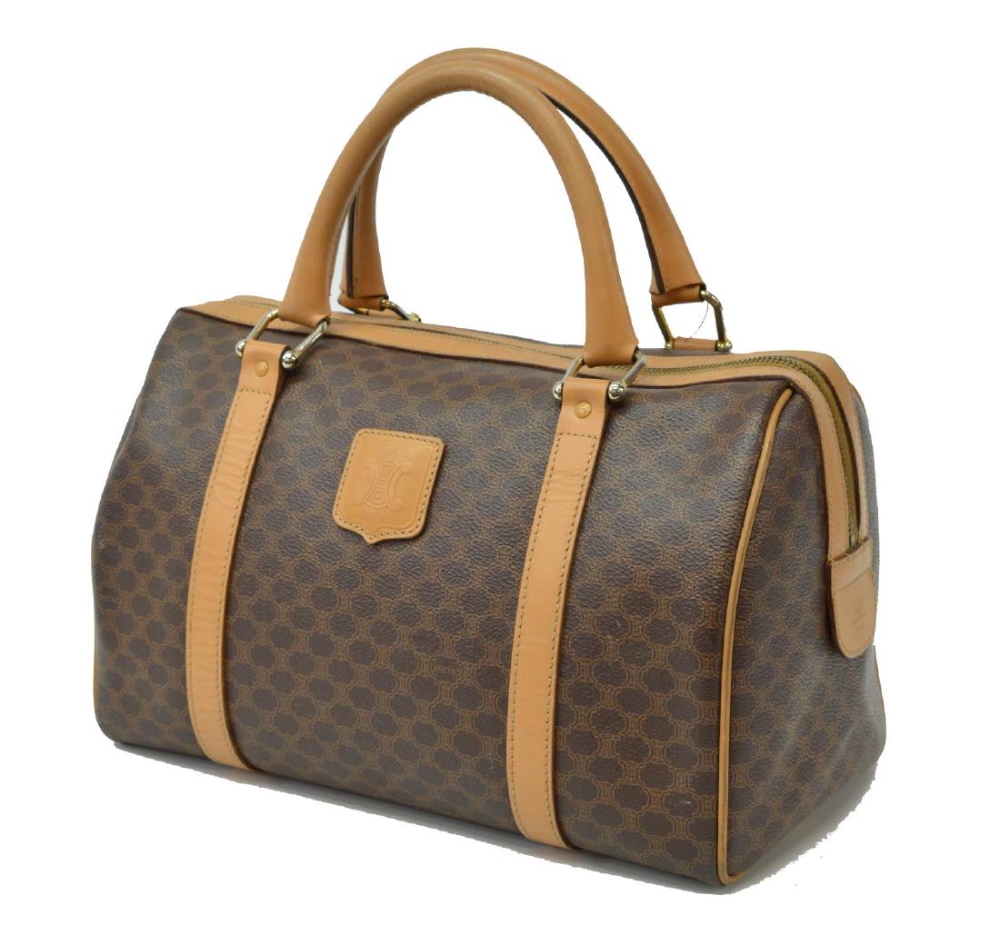 VINTAGE CELINE MACADAME CANVAS 'BOSTON' HANDBAG: Vintage Celine brown Macadame coated canvas 'Boston' bag, having tan leather trim and piping, dual handles affixed by gold tone metal hardware, interior with a single zipper pocket, on four small gilt