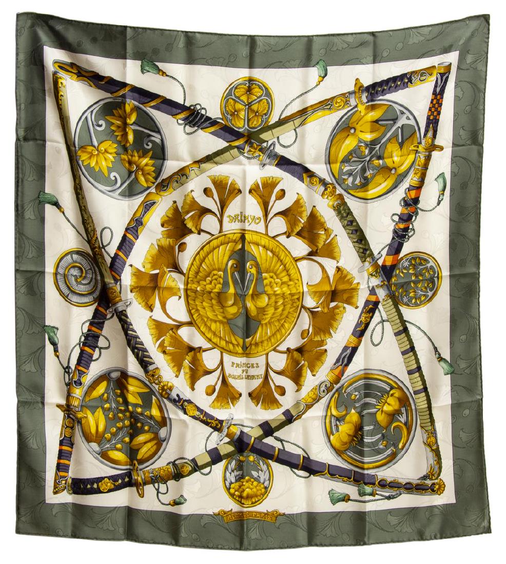 HERMES SILK TWILL SCARF, PRINCES DU SOLEIL LEVANT: Hermes silk twill scarf, "Daimyo Princes du Soleil Levant" pattern, original design by Francoise Faconnet, with green border, center ivory ground, with print inspired by feudal Japan, retaining care t