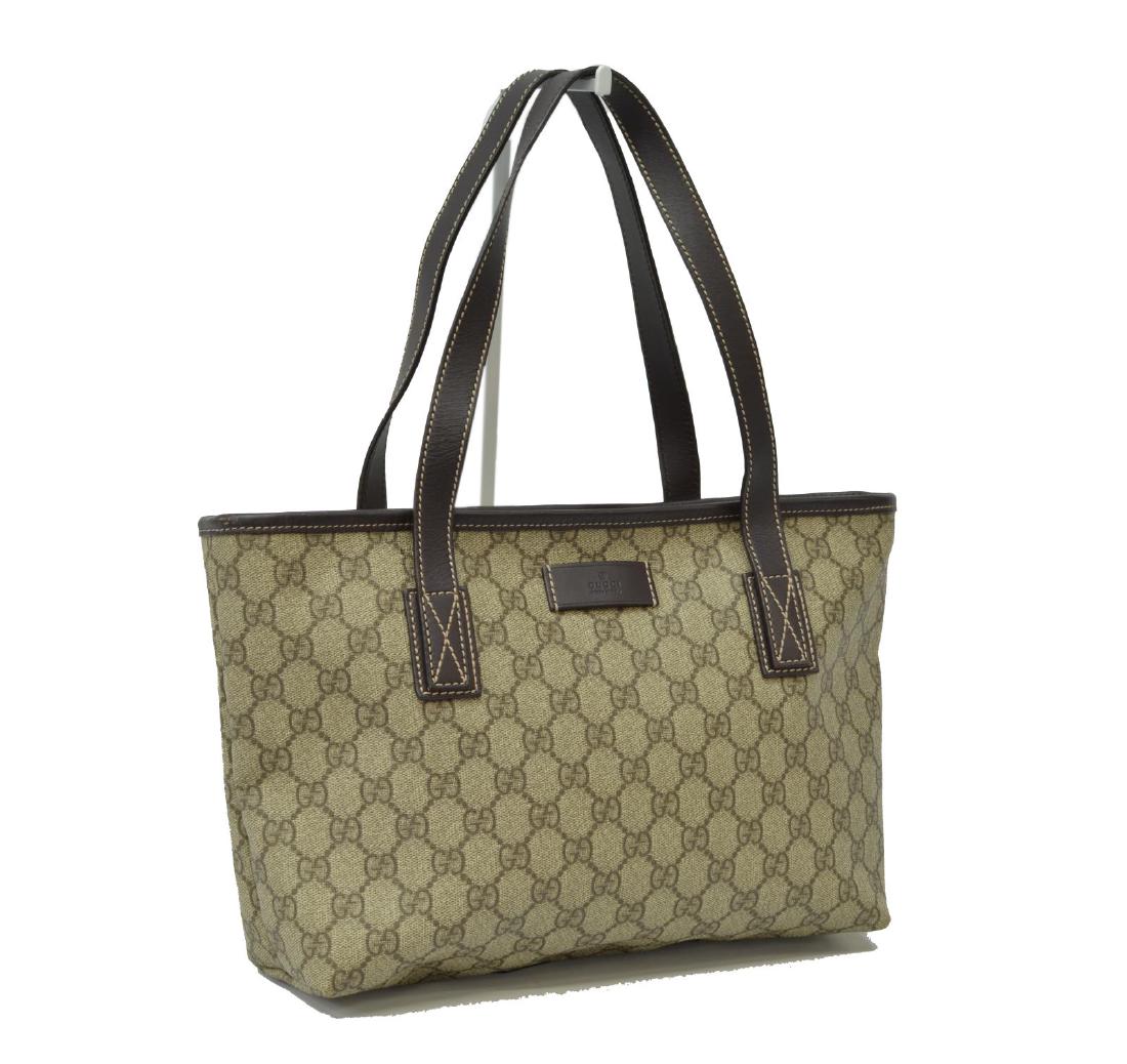 GUCCI BROWN & TAN MONOGRAM COATED CANVAS TOTE BAG: Gucci tote bag, in brown and tan monogram coated canvas, with silver-tone hardware, brown leather trim, dual flat handles, lined interior, zipper closure at top, creasing, bag: measurements for shippi