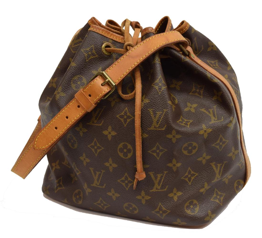 LOUIS VUITTON 'NOE' MONOGRAM CANVAS BUCKET BAG: Louis Vuitton "Noe" bucket bag, in brown and tan monogram coated canvas, with brass hardware, tan vachetta leather trim, single flat shoulder strap, brown canvas lining, drawstring closure at front, c