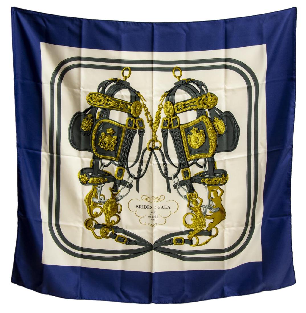 HERMES SILK TWILL SCARF, 'BRIDES DE GALA' PATTERN: Hermes silk twill scarf, "Brides de Gala" pattern, original design by Hugo Grygkar, with navy blue border, center ivory ground, with equestrian print, retaining care tag, measurements for shipping pur