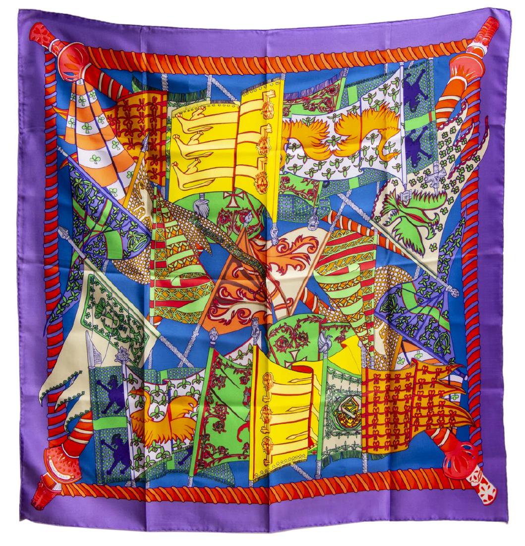 HERMES SILK TWILL SCARF, 'ETENDARDS ET BANNIERES': Hermes silk twill scarf, "Etendards et Bannieres" pattern, original design by Annie Faivre, with purple border, central print of flags and heraldic symbols, retaining care tag, measurements for shippi