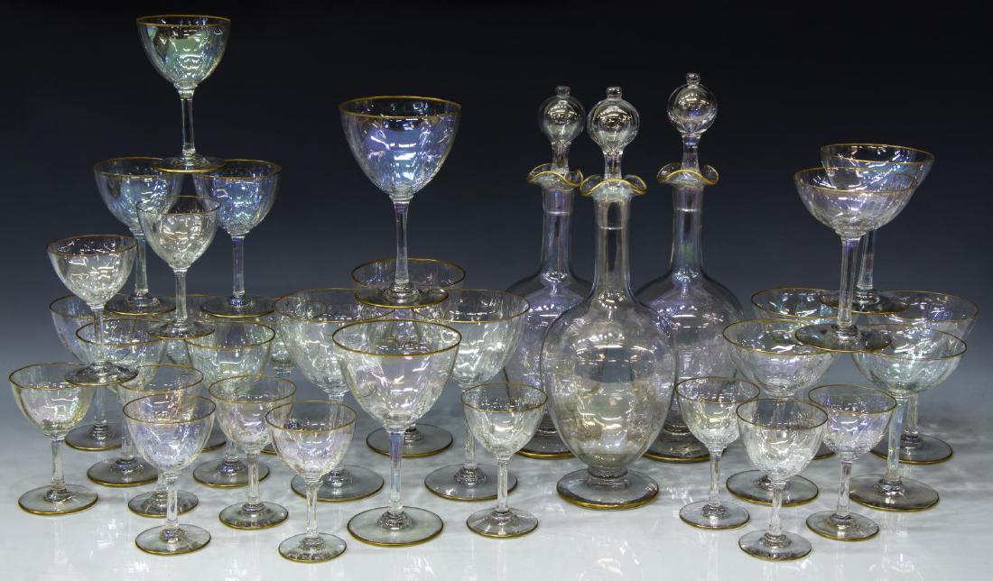 (33) BACCARAT IRIDESCENT CRYSTAL STEMWARE SET: (lot of 33) Baccarat crystal stemware, with iridescent finish and gilt rims, no etched mark (pre 1936), one decanter retaining sticker, attributed as model 10561, including: (5) wine glasses, 6.25"h, 