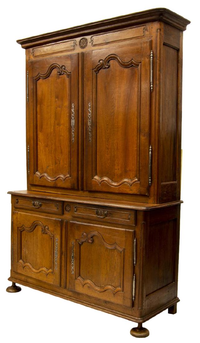 FRENCH LOUIS XVI PERIOD DEUX CORPS CABINET: French Louis XVI period deux corps cabinet, c. 1780, the upper part with a stepped cornice over two doors opening to the shelved interior, the lower part protruding with two drawers above two doors, a