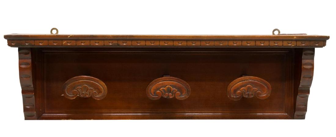 VINTAGE ITALIAN HAT RACK: Vintage Italian hat rack, 20th c., having carving throughout, stepped cornice above three pegs, approx 10"h, 33.5"w, 7.75"d Start Price: $80.00