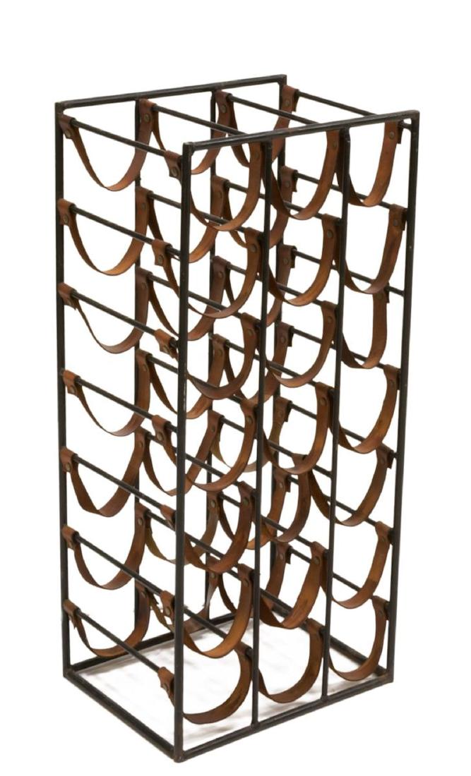 ARTHUR UMANOFF MID-CENTURY MODERN WINE RACK: Mid-century modern wine rack, attributed to Arthur Umanoff (1923-1985), having iron frame, with brown leather slings, approx 30.5"h, 14"w, 11"d Start Price: $80.00