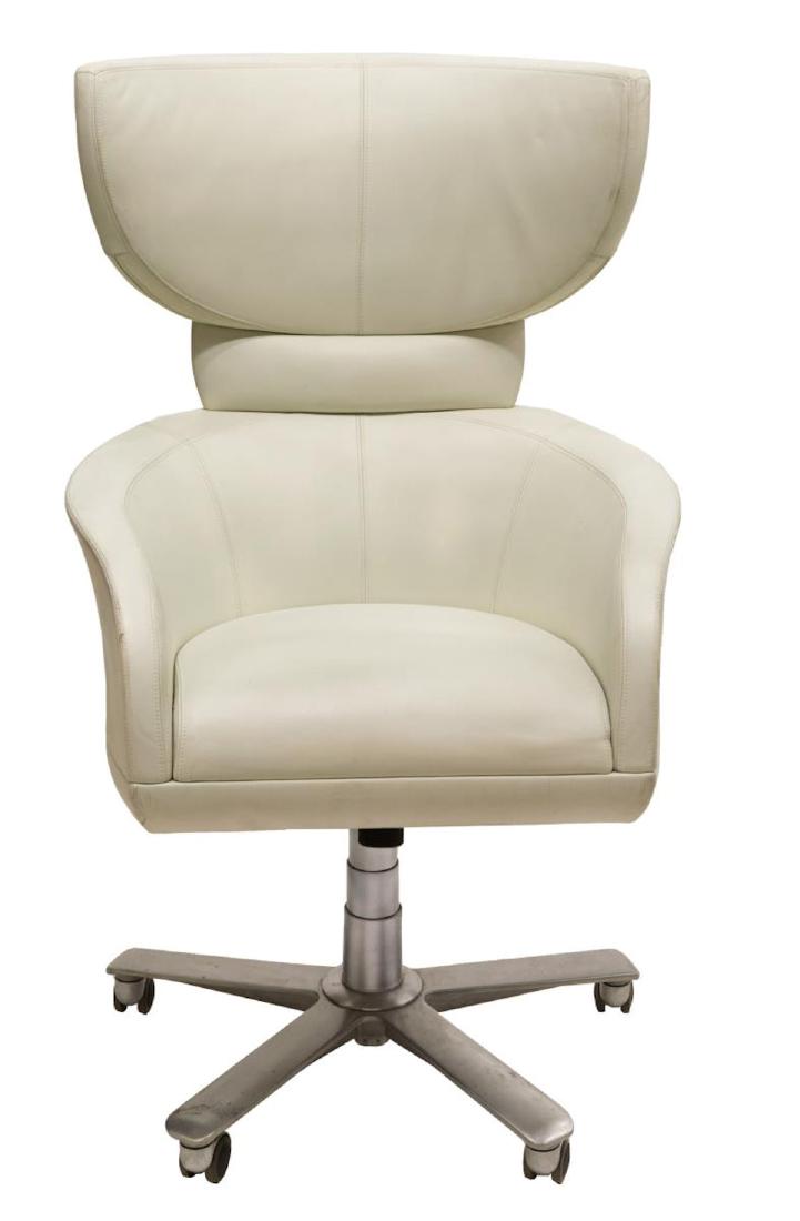 GIORGETTI LEATHER WING CHAIR, DESIGN BY LEON KRIER: Selectus Swivel Wing Chair, design by Leon Krier (Luxembourg, b.1946) for Giorgetti of Italy, upholstered in white stitched leather on an aluminum five point star base with castors, 45"h, 27.5"w, 29"d