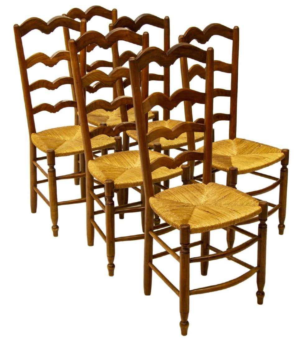 (6) FRENCH PROVINCIAL RUSH SEAT SIDE CHAIRS: (lot of 6) French Provincial side chairs, 20th c., having arched ladder back, over rush seat, rising on turned legs, joined by a double box stretcher, approx 40.5"h, 16.25"w, 14.75"d Start Price: $200