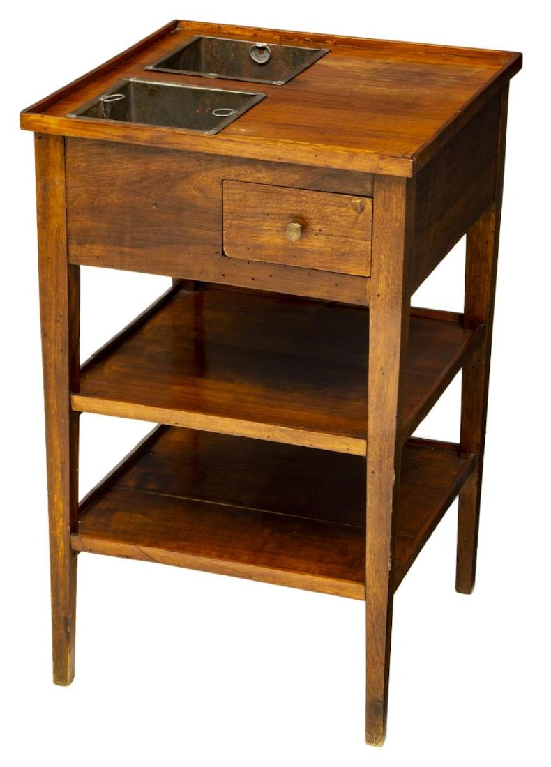 FRENCH TWO BOTTLE WINE COOLER TABLE: French wine cooler table, 20th c., the square top with short rail, a work surface with two removable metal bottle / ice containers, one side with a single drawer above two shelves, rising tapered supp
