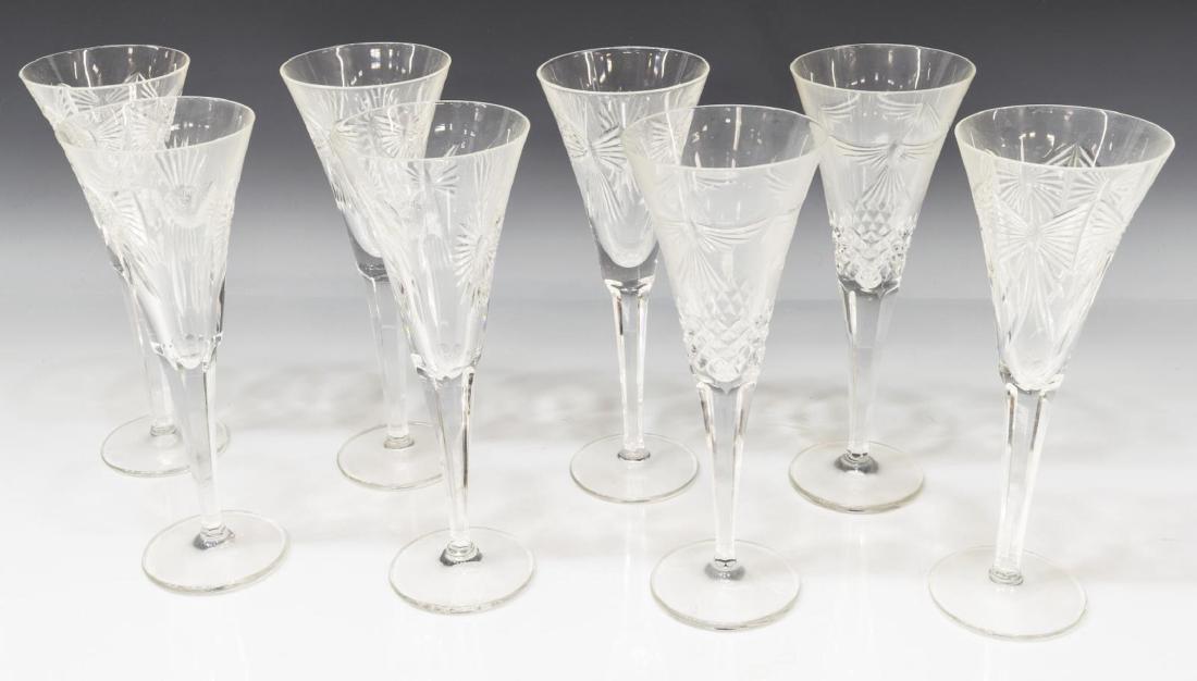 (8) WATERFORD CRYSTAL MILLENNIUM TOASTING FLUTES: (lot of 8) Waterford cut crystal toasting flutes, from the Millennium Collection, including: (2) peace, (2) happiness, (4) millenium; acid etched mark underfoot, approx 9.25"h, 3.5"diam, 7lbs total St