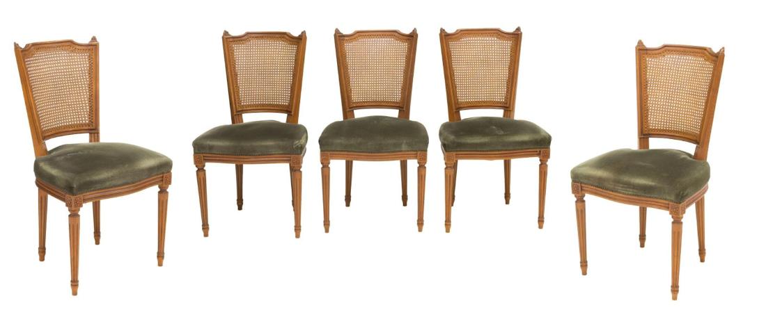 (5) FRENCH LOUIS XVI STYLE RATTAN BACK CHAIRS: (lot of 5) French Louis XVI style chairs, 20th c., fluted frame surrounding rattan backs and upholstered seats, carved rosettes at corners of frame surrounding seat, brass tacking, legs resting upon a